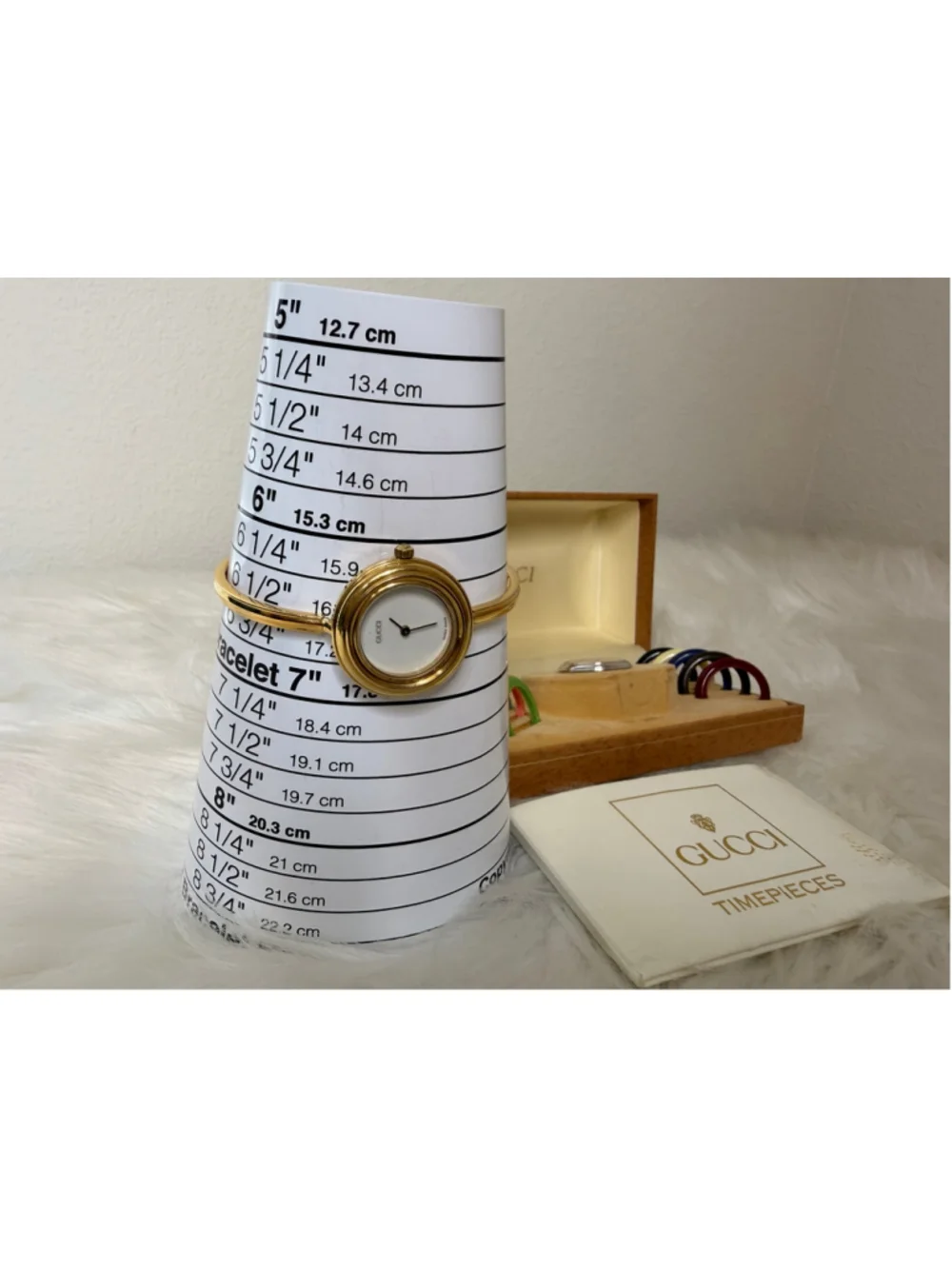 Gucci 11/12.2 Interchangeable Bezel Bangle Watch, w/ 12 bezels, box & paperwork